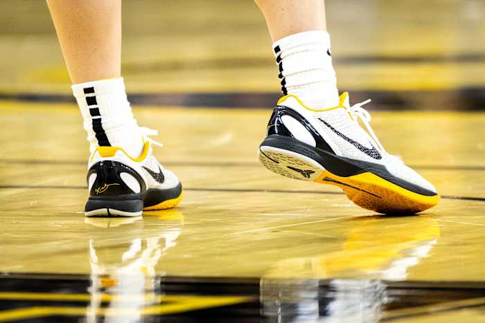 Iowa Hawkeyes guard Caitlin Clark's white and black Nike Kobe sneakers.